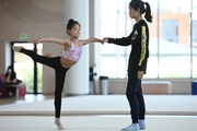 A coach and a gymnast from China during the workout