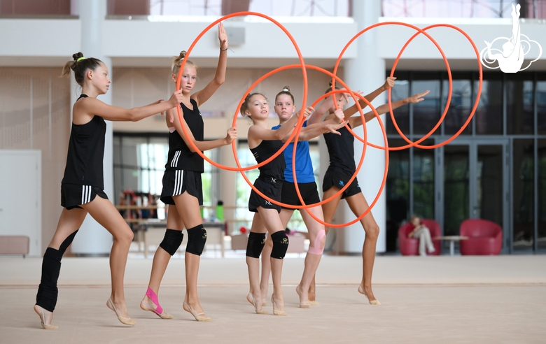 Gymnasts performing an exercise with hoops