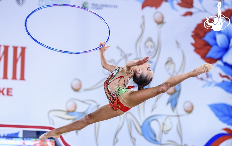 Ksenia Savinova performs the spilt leap with the hoop