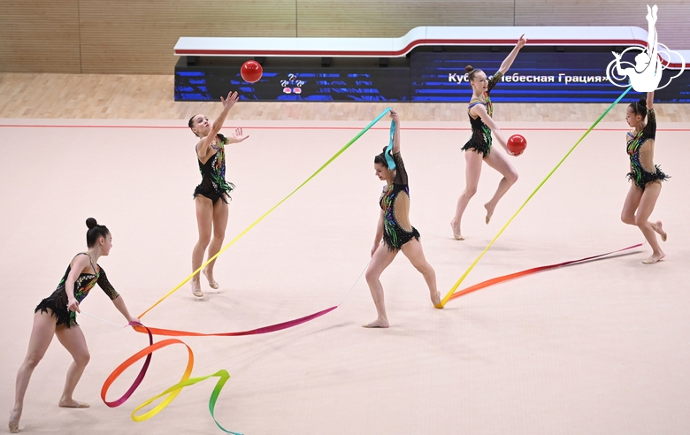 Gymnasts during an exercise with balls and ribbons