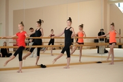 Gymnasts practice choreography during the recovery camp at the Academy