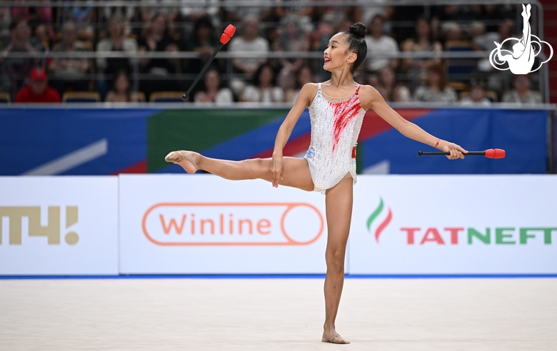 Asel Arapova during the exercise with clubs