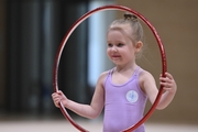 Young gymnast during an exercise with a hoop at the mAlinka tournament