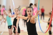 Gymnast during an exercise with a hoop during training