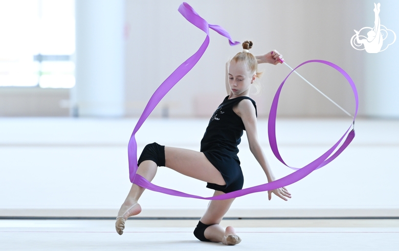 Olga Chernykh with a ribbon during training