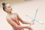 Gymnast during an exercise with clubs