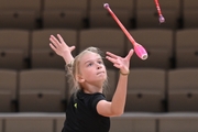 Alexandra Borisova during an exercise with clubs at an assessment training session