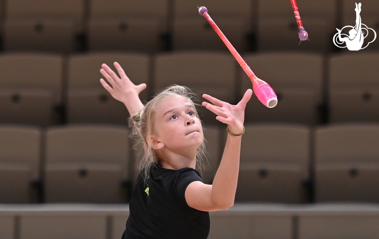 Alexandra Borisova during an exercise with clubs at an assessment training session