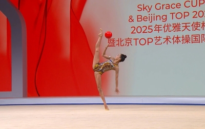 Olympic champion Alina Kabaeva and the distinguished guests watch the gymnasts' performances