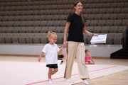 Academy coach Elizaveta Chernova with a young gymnast during the selection