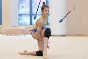 Karolina Tarasova during an exercise with clubs at a control training session