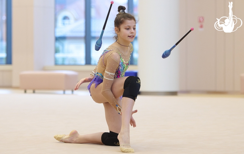 Karolina Tarasova during an exercise with clubs at a control training session