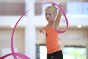 Gymnast performs an exercise with a ribbon