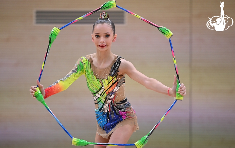 Gymnasts during an exercise with clubs