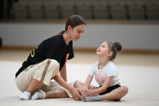 Academy coach Elizaveta Chernova with a young gymnast during the selection process