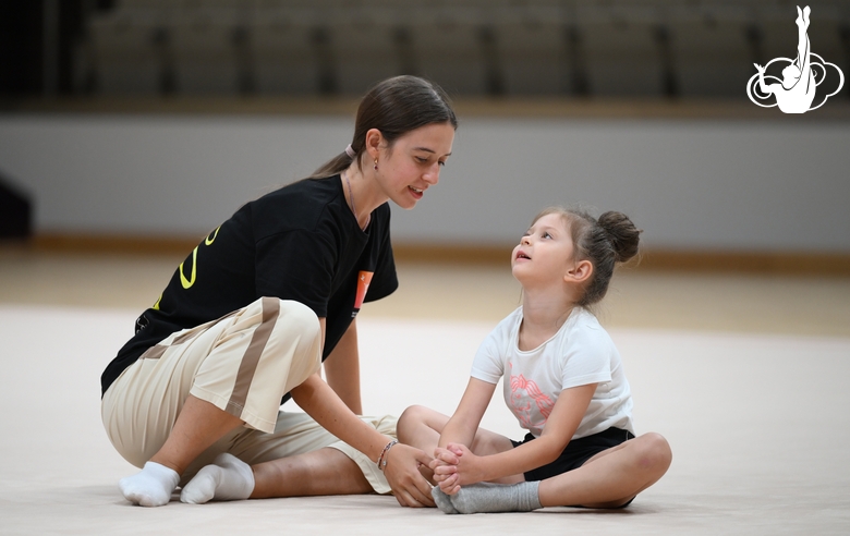 Academy coach Elizaveta Chernova with a young gymnast during the selection process