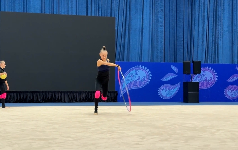 Juniors checked their routines during floor testing before the start of the Shining Star international competition