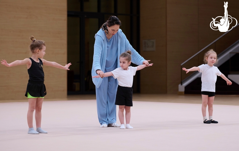 Academy coach Olesya Kovaleva with young gymnasts during the selection process