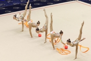 Gymnasts during an exercise with balls and ribbons