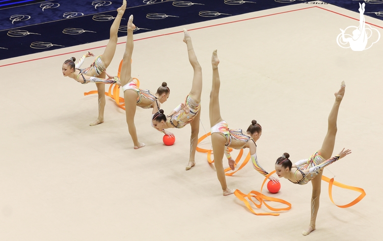 Gymnasts during an exercise with balls and ribbons