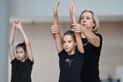 Coach Natalya Shmakova and a gymnast during the workout