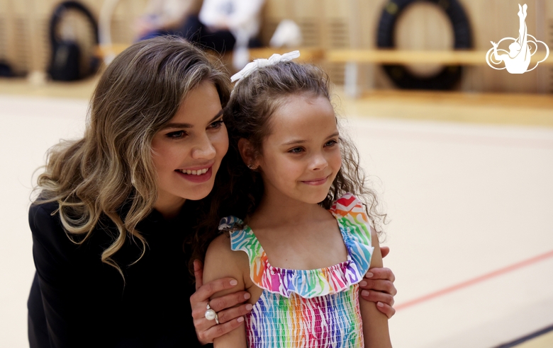 Olympic champion Alina Kabaeva with a young gymnast  at the Sky Grace Grand Prix tournament