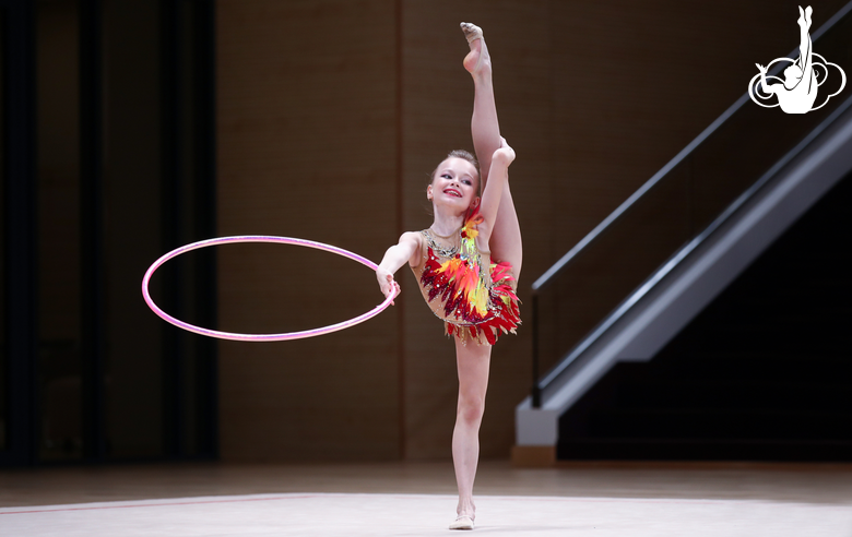 Young gymnast shows a hoop routine at the assessment training session