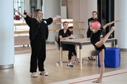 Academy coach Evgeniy Eliseeva, Dina and Arina Averina with Diana Solosina during training