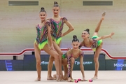 Gymnasts during an exercise with clubs