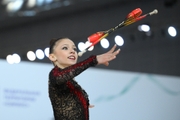 Arina Kovshova during exercise with clubs