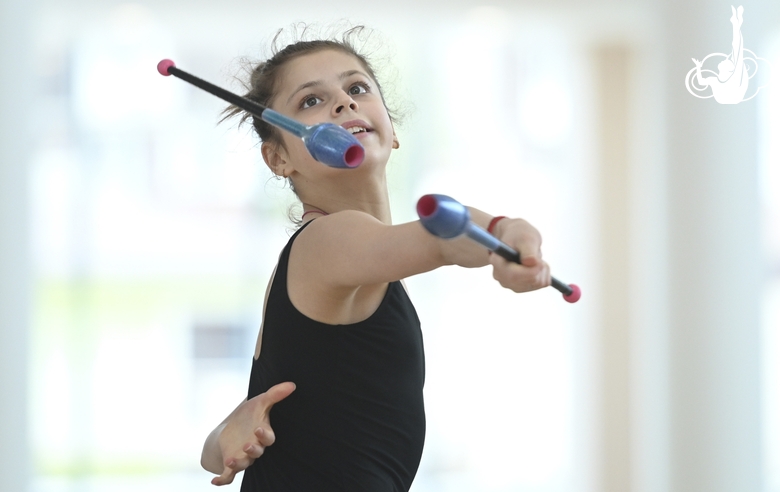 Karolina Tarasova during an exercise with clubs