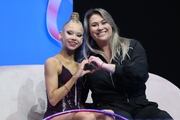 Eva Kononova with coach Evgenia Eliseeva after an exercise with a hoop