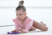 Young gymnast during an exercise with a jump rope