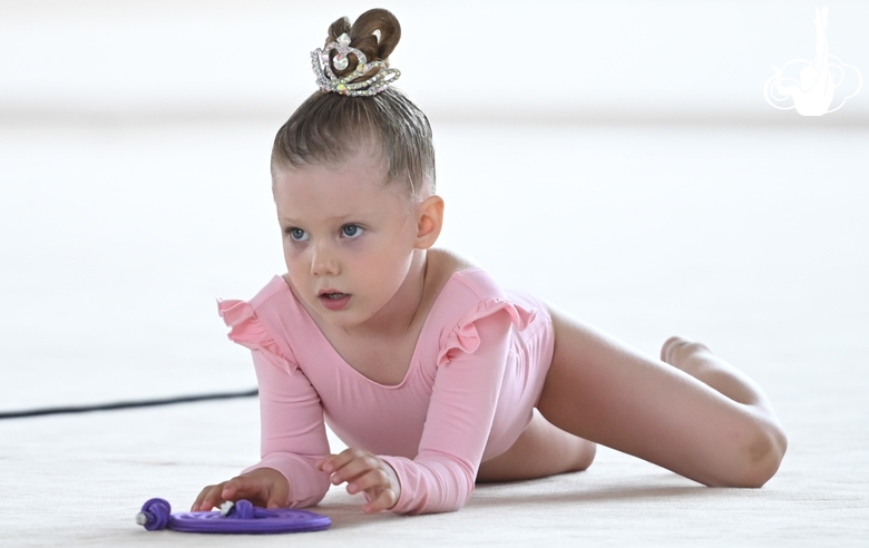 Young gymnast during an exercise with a jump rope