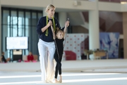 Academy Coach Anna Ustsova with a young gymnast during the exercise