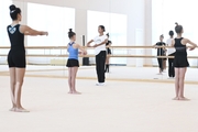 Academy choreographer Ekaterina Belova with gymnasts during training