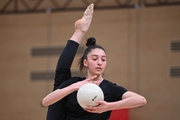 Gymnast during an exercise with a ball during floor testing