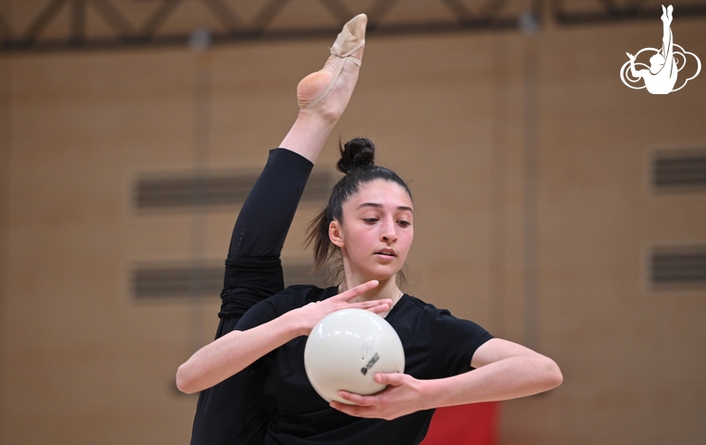 Gymnast during an exercise with a ball during floor testing