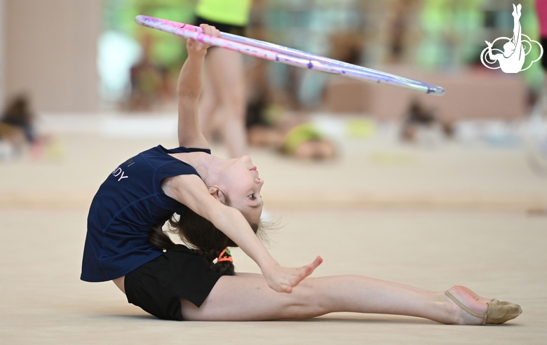 Gymnast during an exercise with a hoop at training