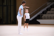 Academy coach Elizaveta Chernova with a young gymnast during the Academy selection process