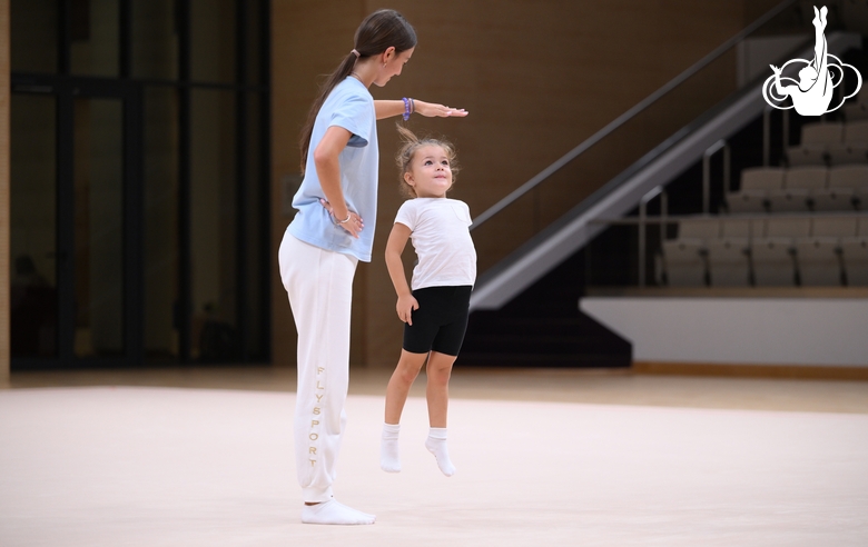 Academy coach Elizaveta Chernova with a young gymnast during the Academy selection process