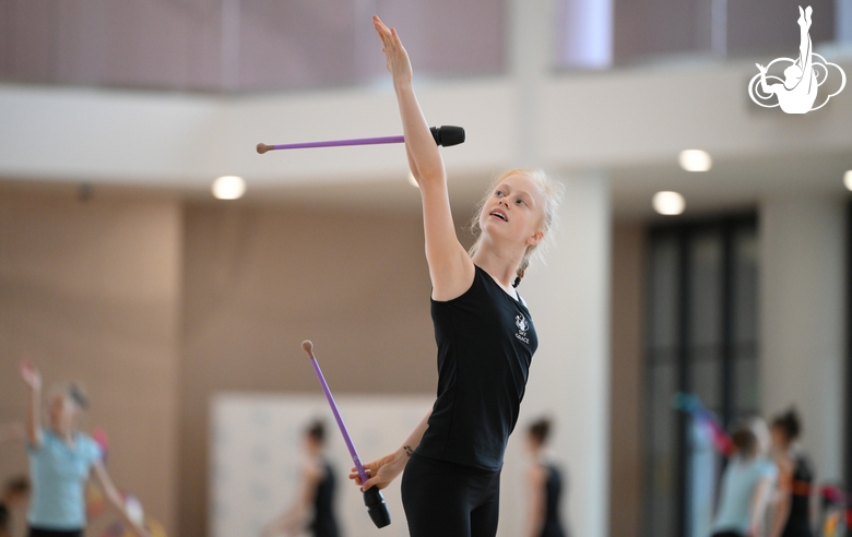 Olga Chernykh during an exercise with clubs