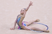 Young gymnast doing an exercise with a hoop